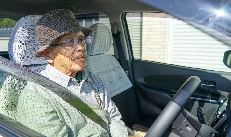 Older adult driving a car