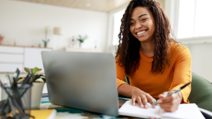 Woman at her desk on on her laptop